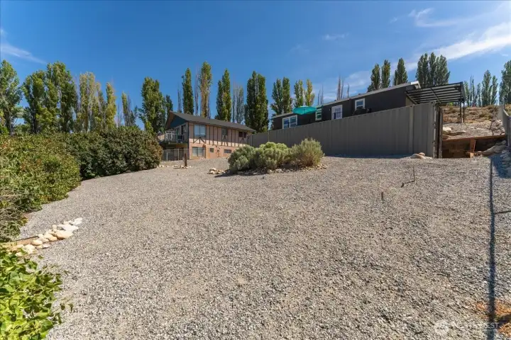 Lower level outdoor area with storage container.