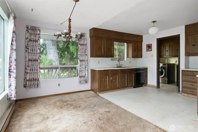 Dining, kitchen, and laundry upstairs — bring your tools and elbow grease, sweat equity is calling your name!