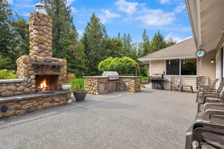 Large entertaining patio with fireplace and plumbed BBQ