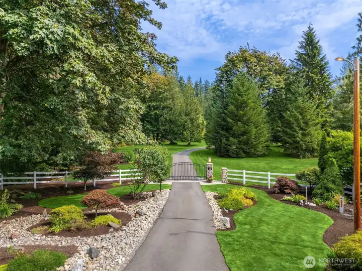Driveway into home with private gated entrance
