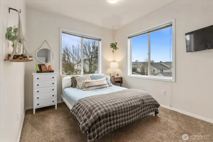 2nd bedroom with lots of light. Bonus window being the end unit!