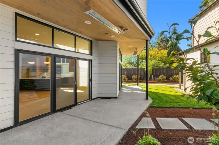 Covered back patio with heaters, leads to you to the  detached garage with additional  living space living space complete with wet bar and 3/4 bath