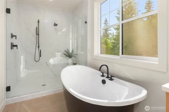 Designer tub and large walk-in shower.