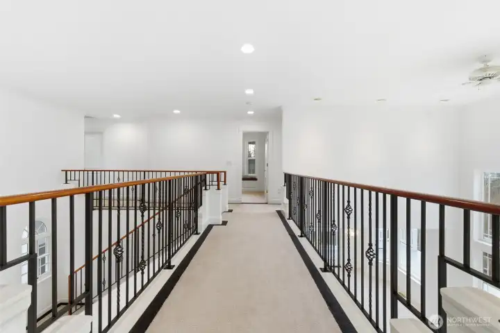 Stairway from primary bedroom to guest bedrooms