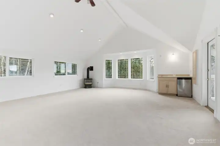 Second floor rec room with propane fireplace and wet bar