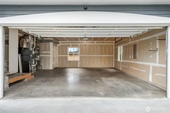 Expansive two-car garage with room to park and still carve out space for a home gym and your Peloton