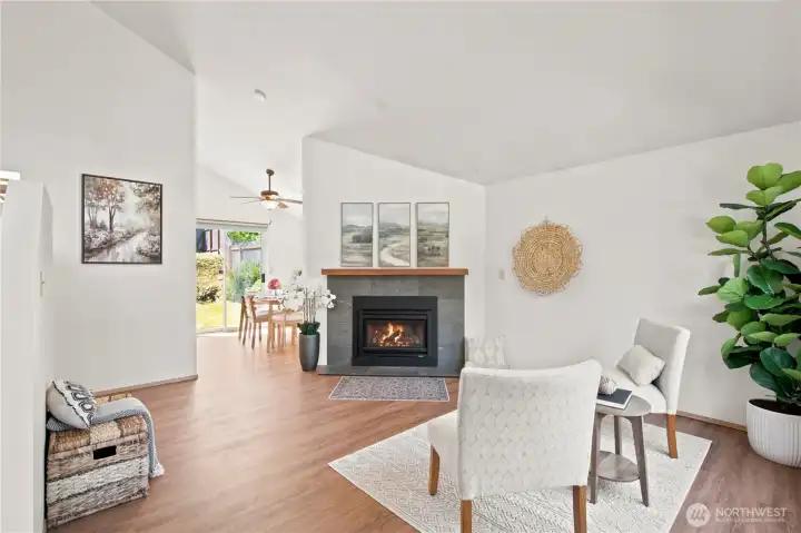 Cozy living room with abundance of natural light, and a modern gas fireplace for chilly days.
