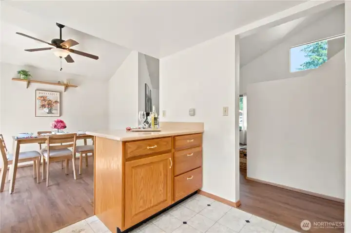 Spacious kitchen with Corian countertops and farm kitchen sink