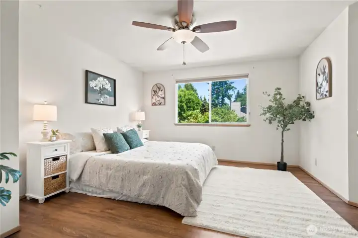 Spacious Primary Bedroom, ceiling fan, large walkin closet, and en suite recently remodeled 3/4 bath
