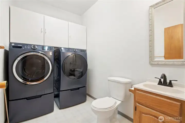 Utility Room and 1/2 bath on main floor with nearly new Washer and Dryer.