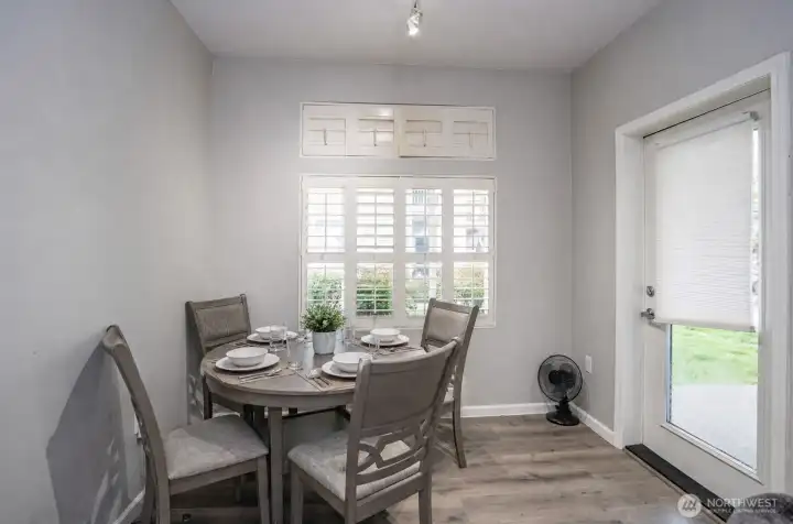Comfortable dining area with a convenient door that opens to the covered patio.