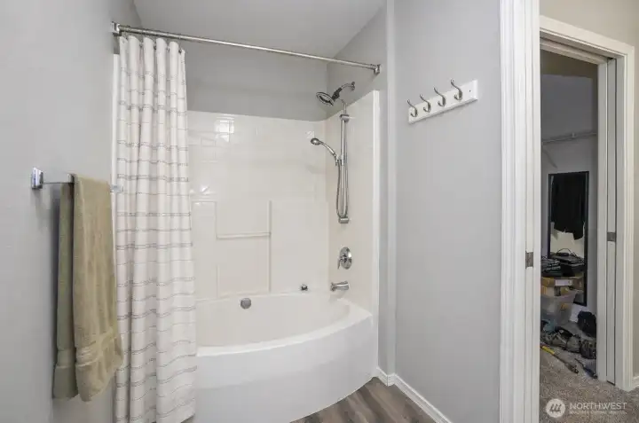 Primary ensuite includes a separate water closet for added privacy, with a walk-in closet conveniently located to the right.