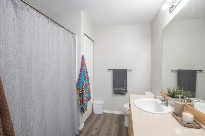 Alternate view of the guest bathroom showcasing its clean and functional design.
