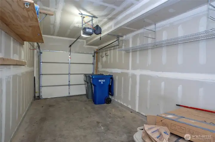 Individual one-car garage with added shelving for extra storage and organization.