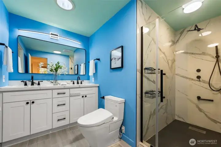 Remolded master Bathroom has a granite countertop, Toto bidet and advanced shower room