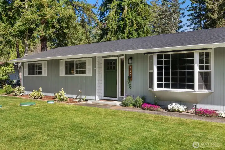 Beautiful curb appeal. Fresh plantings throughout. Notice the brand new roof!
