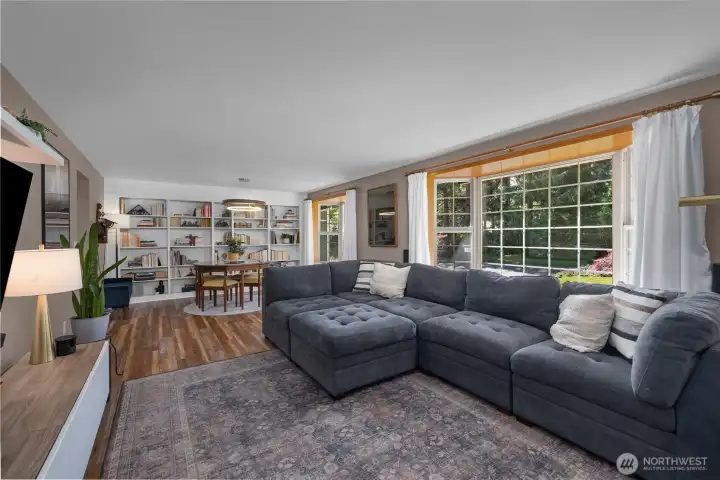 Notice the 2 large bay windows inviting in lots of light.