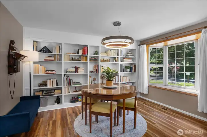 Stunning dining space - notice all new lighting throughout home and quality craftsmanship with built ins throughout.