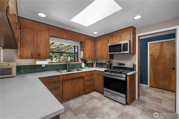 Alternate view of kitchen. Laundry space lies towards rear.