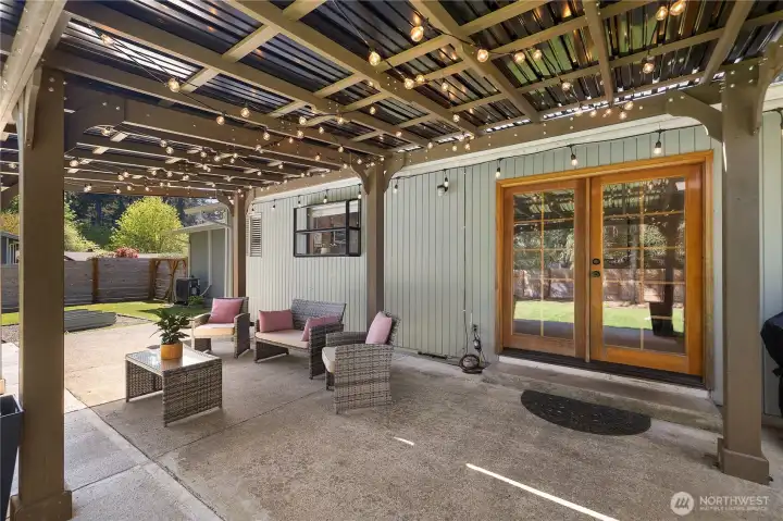 View from pergola looking back towards french doors into kitchen/2nd living space.