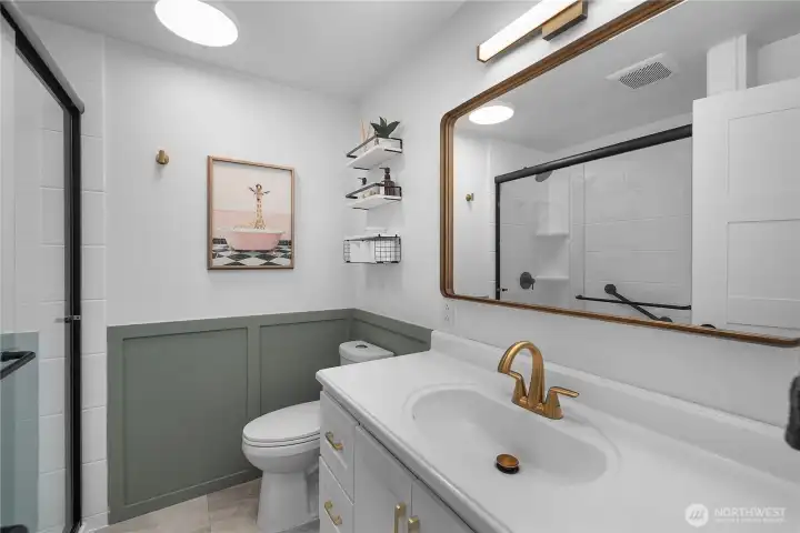 .75 bath easily accessible from living spaces. Brand new 0 step entry shower, fixtures, and lighting!