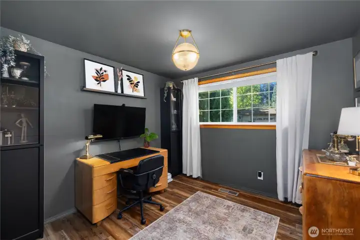 1st bedroom currently being used as an office! New light fixture hangs above.