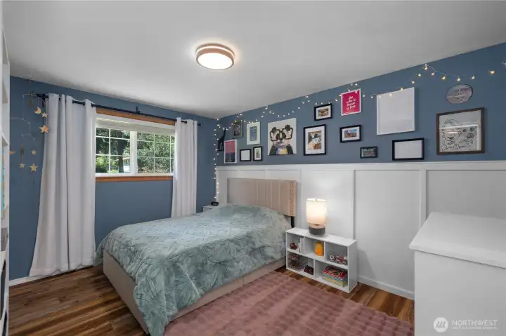 Bedroom number 2 is also a fantastic size. Great wainscoting and built in cabinetry customize the space.