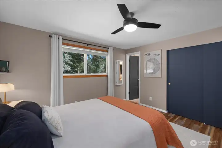 Alternate view of primary suite. Window has views to private backyard, closet directly ahead with door access to primary bath.