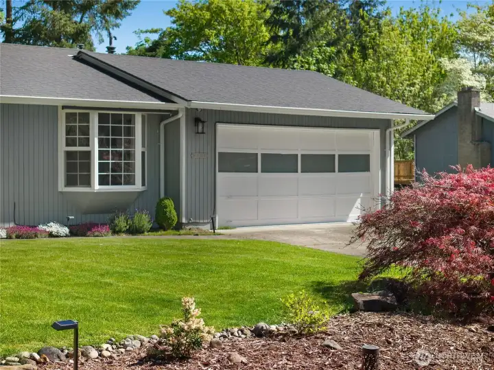 2 car garage with an abundance of parking.