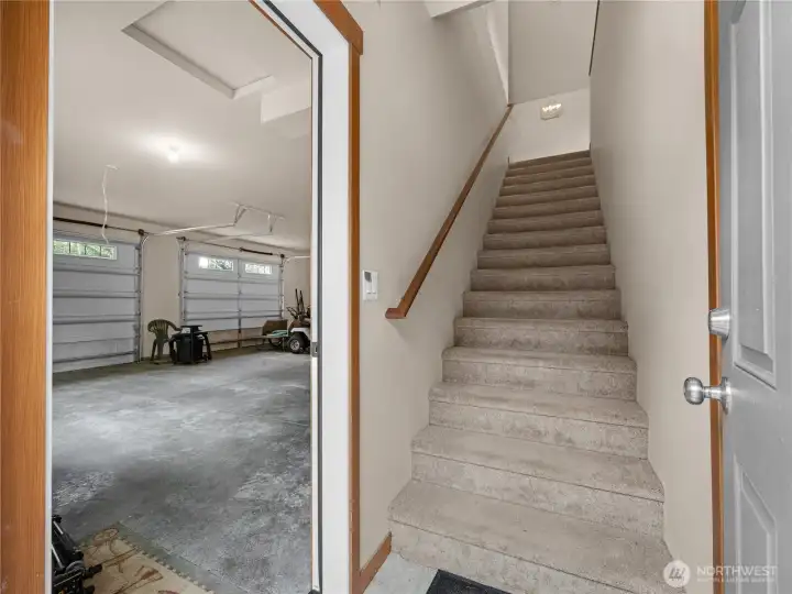 Entry staircase leading to the finished upper-level living space above the garage.