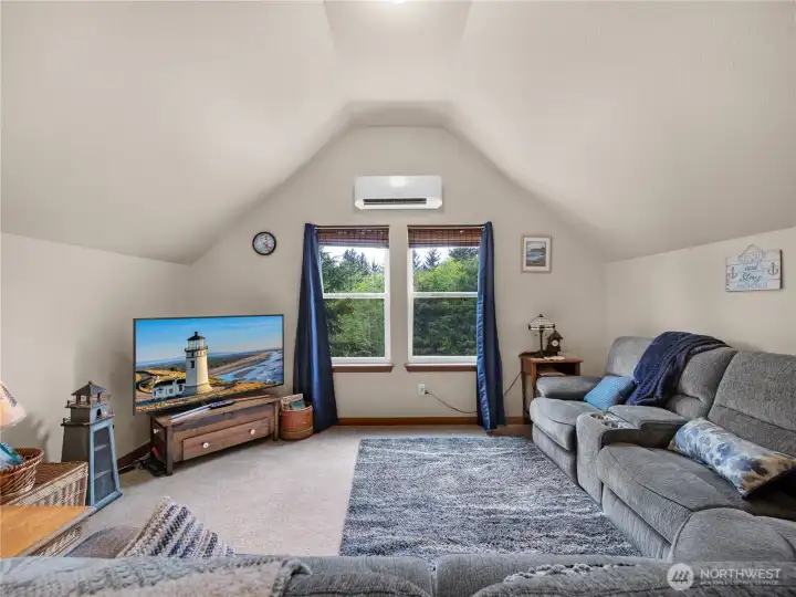 Comfortable loft retreat with direct outdoor access and flexible layout options.