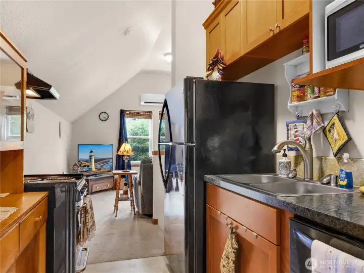 Kitchen and living area combination designed for comfortable everyday living.