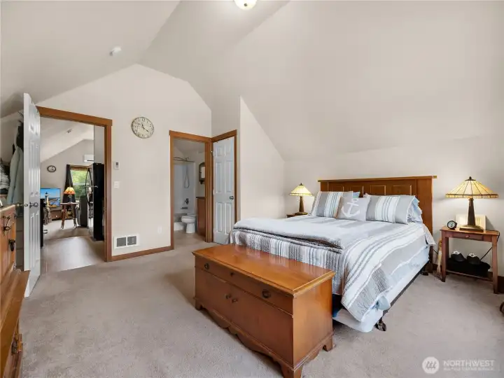 Generous bedroom layout with easy access to the adjoining bathroom and living areas.