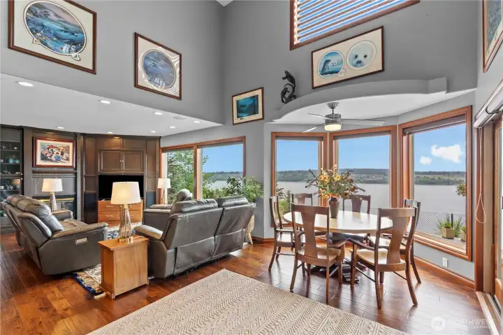 Family room next to eat-in area with wall of windows