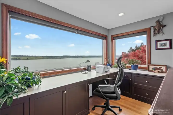 At top of stairs is this open office with a spectacular view of the sound