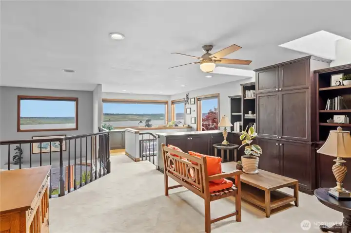 Media room or work out room with plenty of built in cabinets