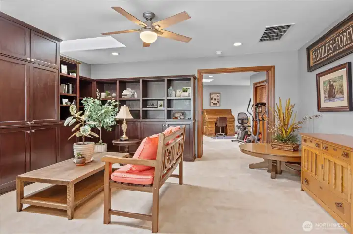 Looking past media room into 1 of 3 bedrooms on upper level