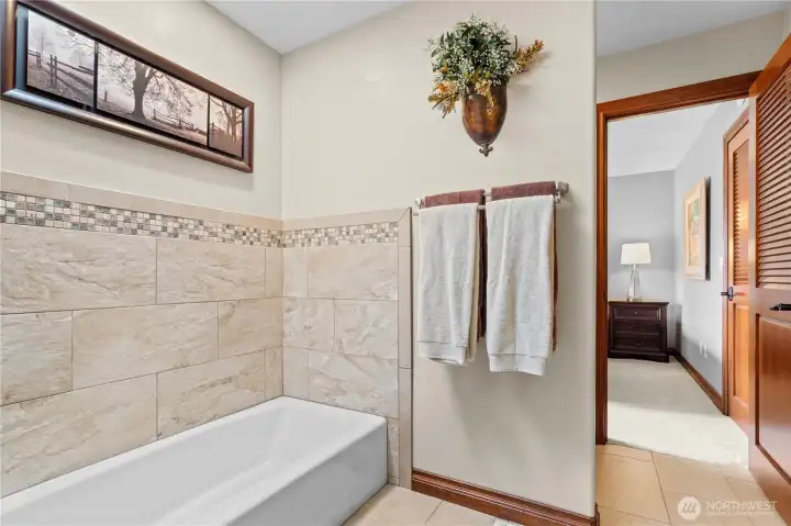 All new tile, fixtures, cabinets, vanities