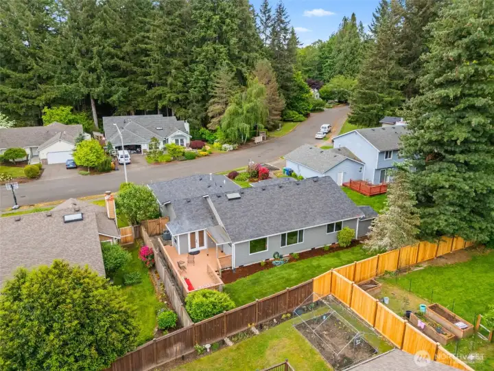 Aerial view showing the back deck, storage shed and rear and side fenced yards. Aerial view showing the back deck, storage shed and rear and side fenced yards.