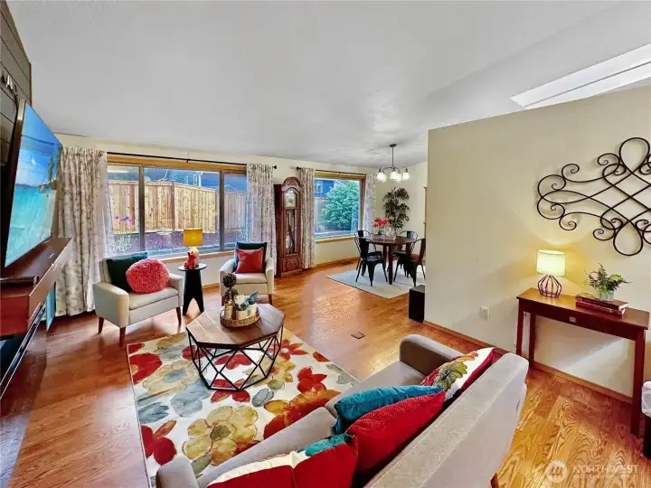 Another living room view showing the access to the dining room and large windows with view of the backyard. Another living room view showing the access to the dining room and large windows with view of the backyard.