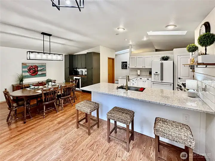 Just off the kitchen is the family room which is currently being used as another eating area. Just off the kitchen is the family room which is currently being used as another eating area.