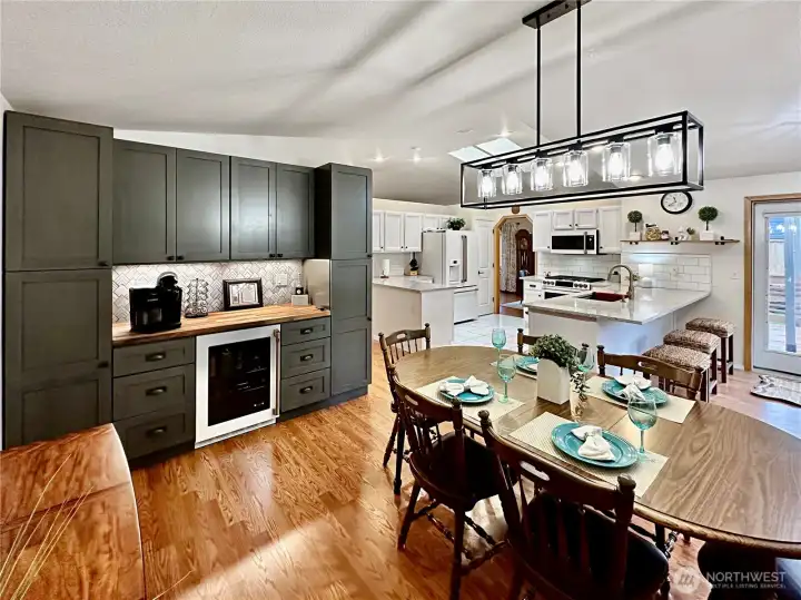 View of the build-in cabinets, wine/pop refrigerator and beautiful wood counter. What a great space for a coffee bar. View of the build-in cabinets, wine/pop refrigerator and beautiful wood counter. What a great space for a coffee bar.