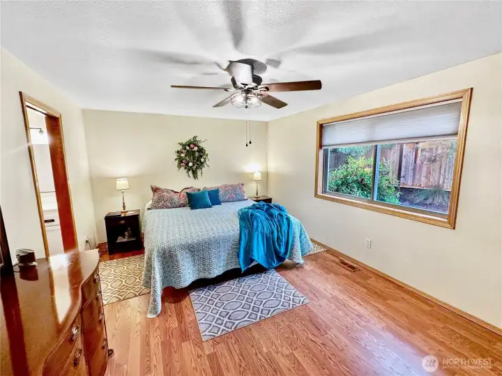 Primary bedroom with laminate floor, ceiling fan and room for a king size bed! Primary bedroom with laminate floor, ceiling fan and room for a king size bed!