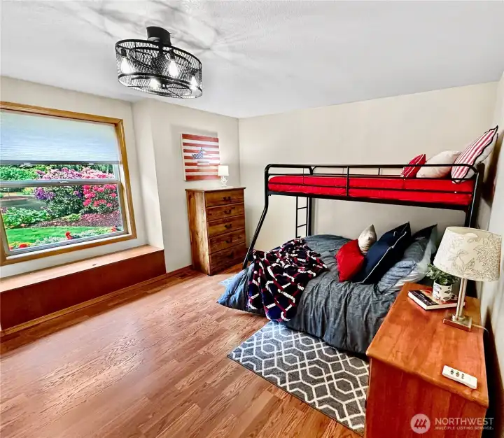 Front bedroom with window seat, laminate floor and new light fixture. Front bedroom with window seat, laminate floor and new light fixture.