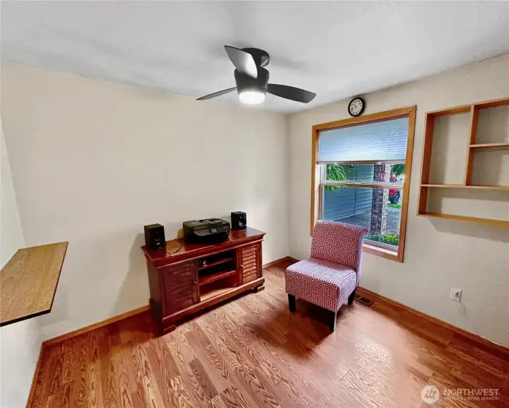 3rd bedroom which was used as an office featuring a ceiling fan and laminate floor. 3rd bedroom which was used as an office featuring a ceiling fan and laminate floor.