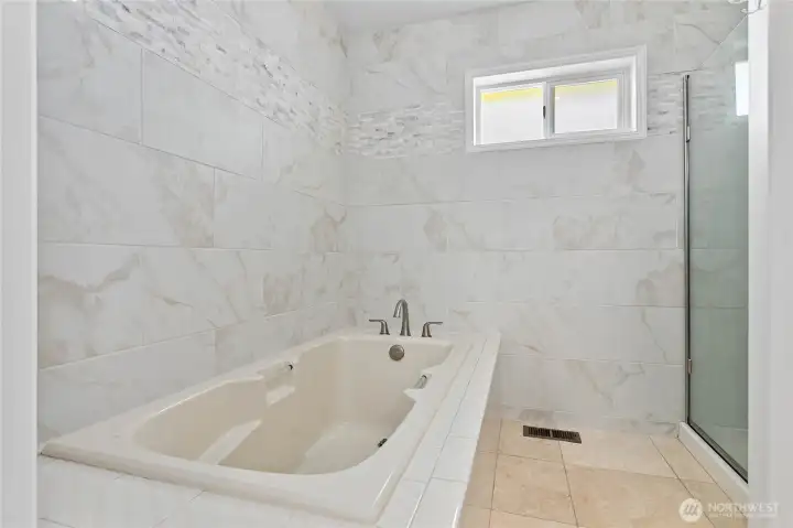 Primary bathroom tub and shower Primary bathroom tub and shower
