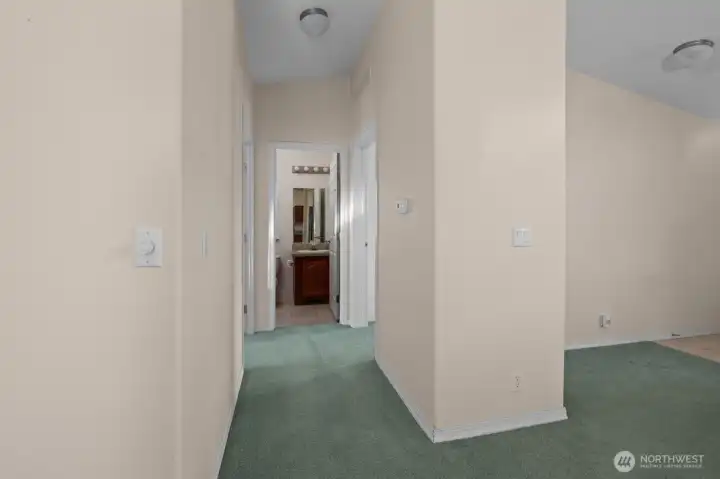 Hallway off living room leads to 2 guest bedrooms & bathroom
