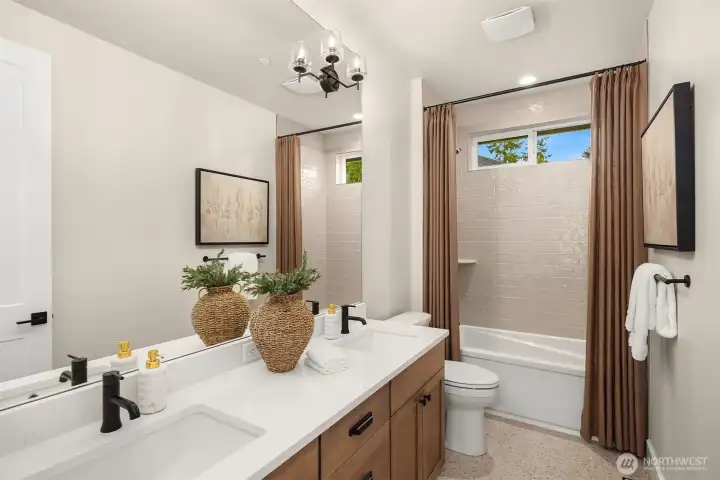 Staged photos of similar home on Lot 6.