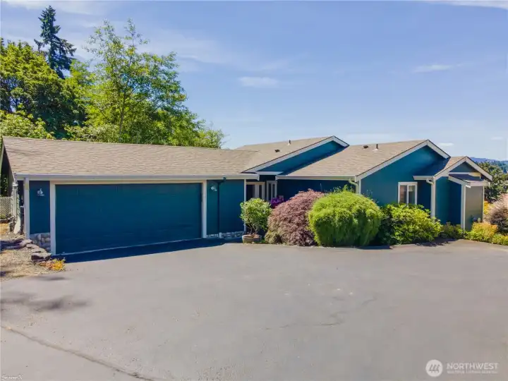 Front of this Condo with a double car garage.