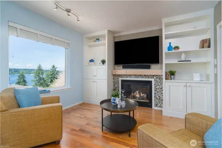 Natural Gas Fireplace with built ins.  Hardwood floors and ceiling fan.  Views looking West
